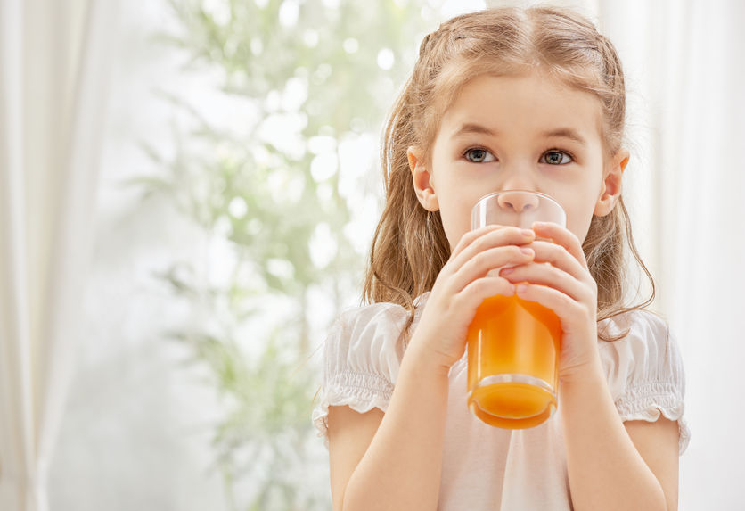 37039409 - a beautiful girl drinking fresh juice