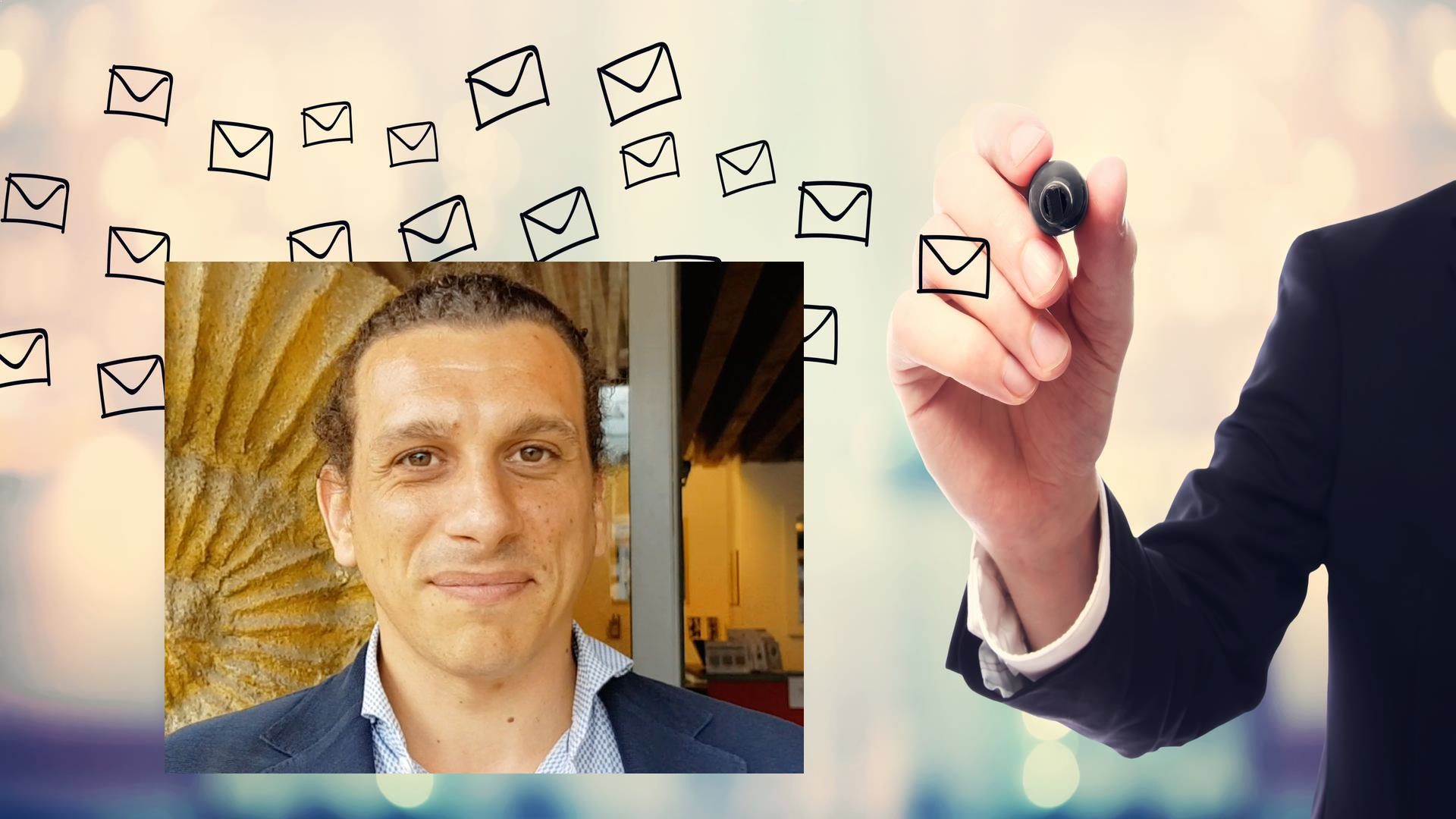Businessman drawing E-mails concept on blurred abstract background