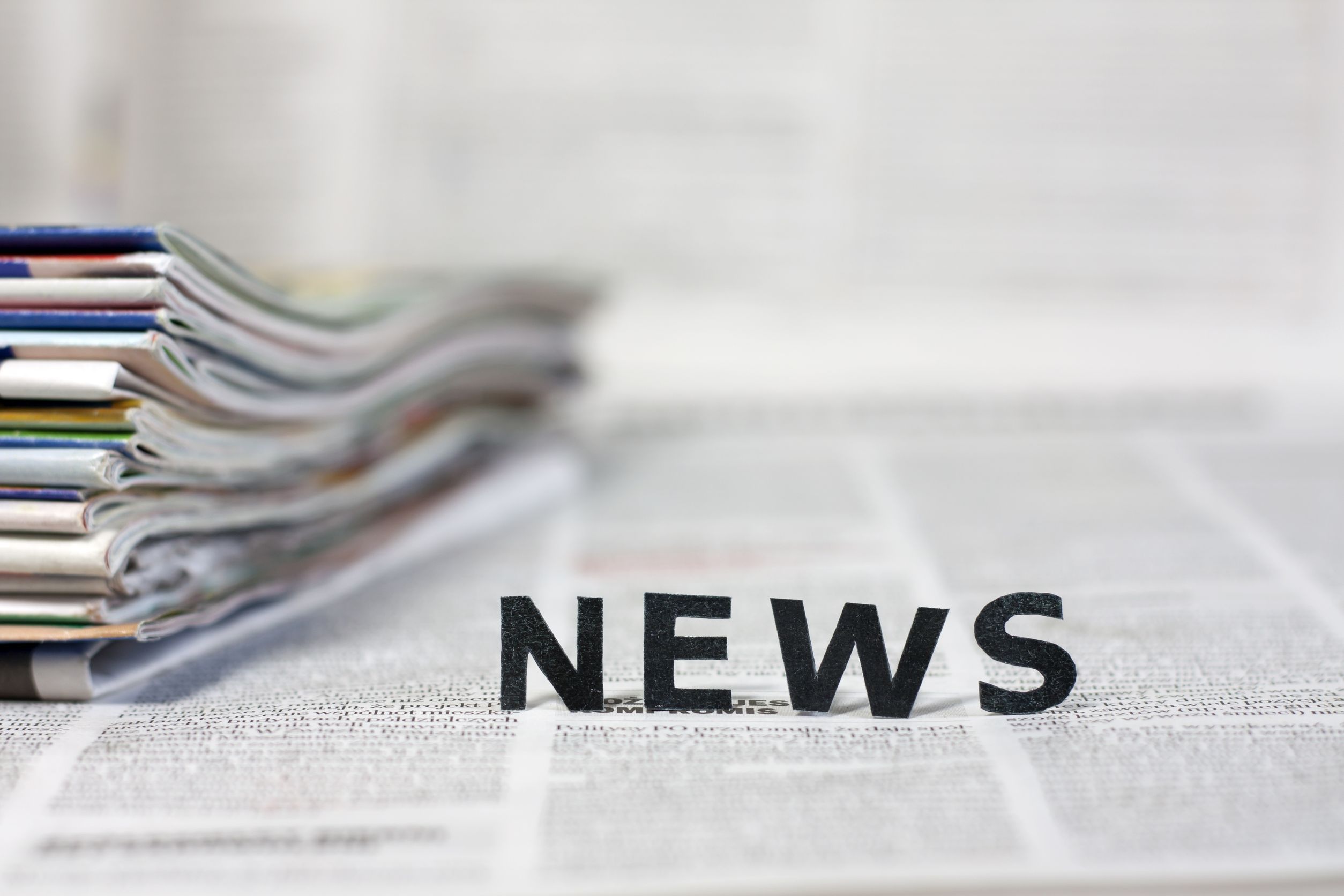 20165301 - news letters on newspapers with blurred background concept