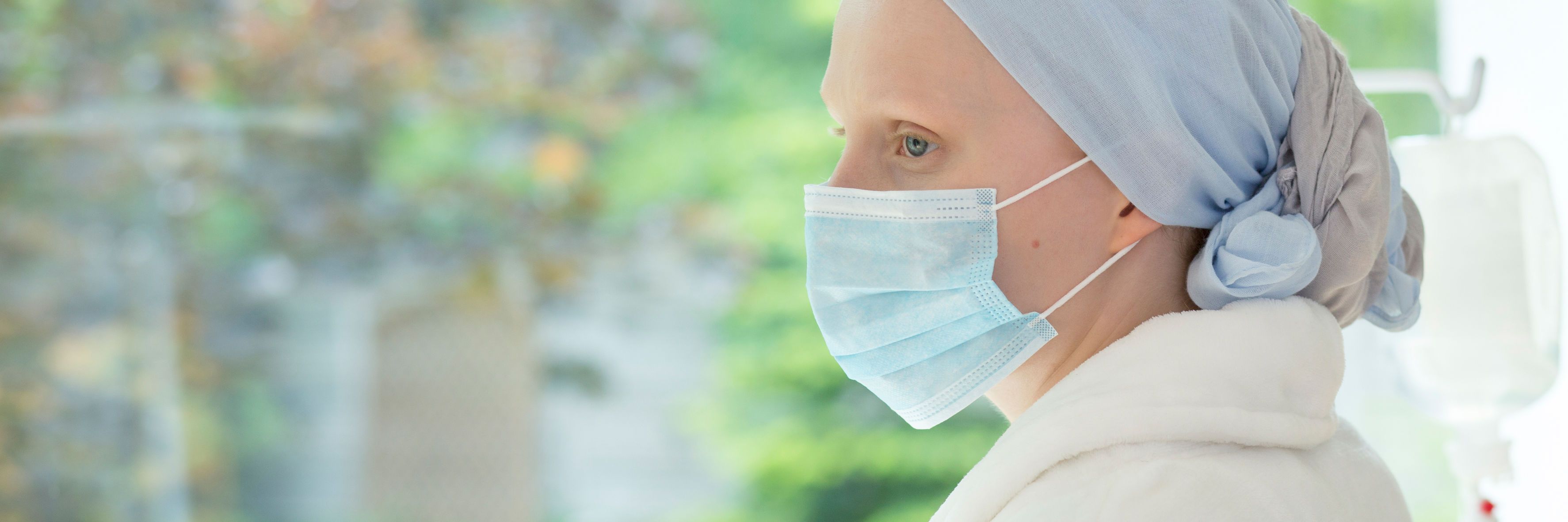 Panorama of weak woman with a mask on her face during treatment