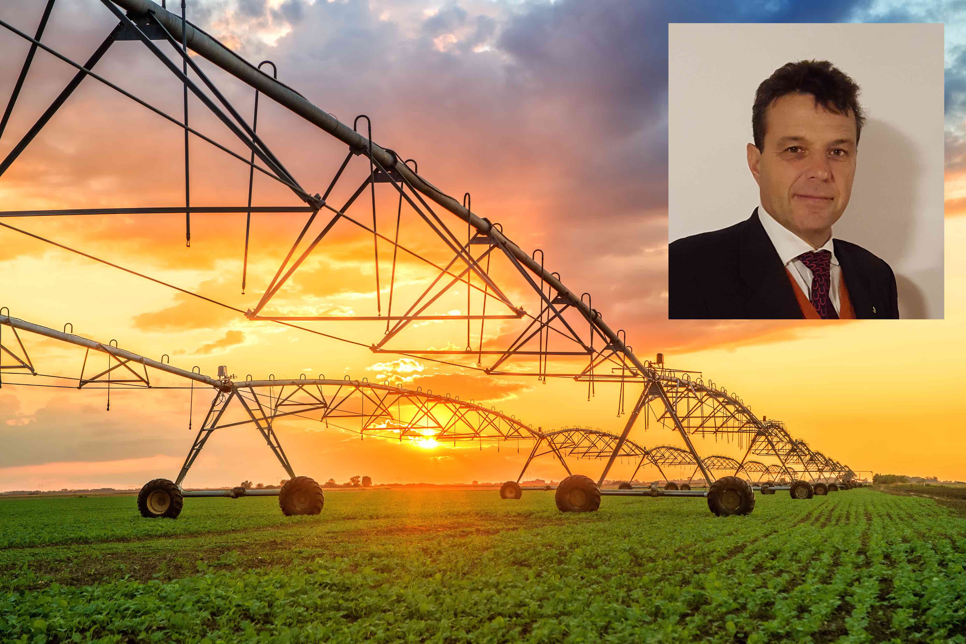 Automated farming irrigation system in sunset