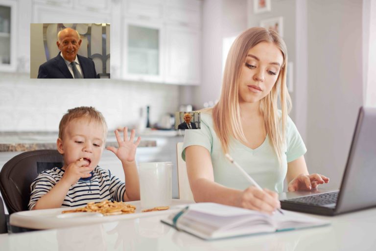Working mother with child in the kitchen