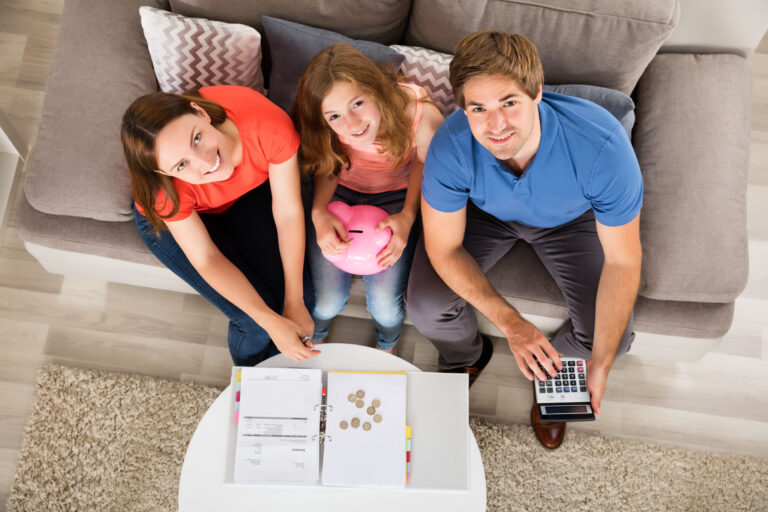 Smiling Family Calculating Tax