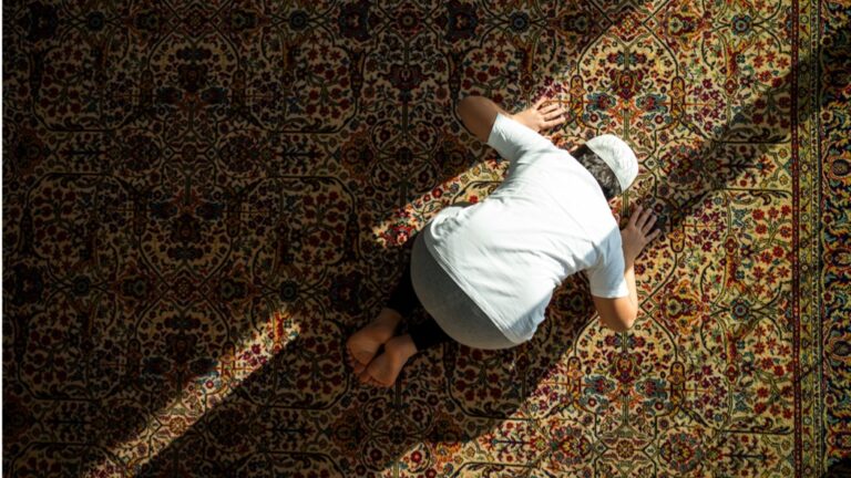 Muslim child inside mosque praying