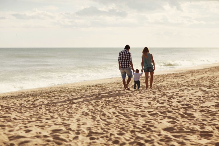Family walking on the beach