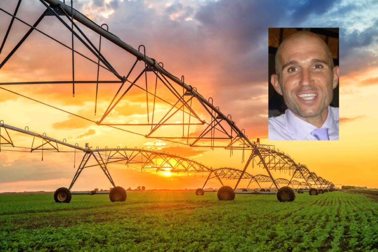 Automated farming irrigation system in sunset