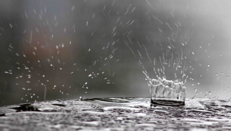 raindrops falling on a table surface
