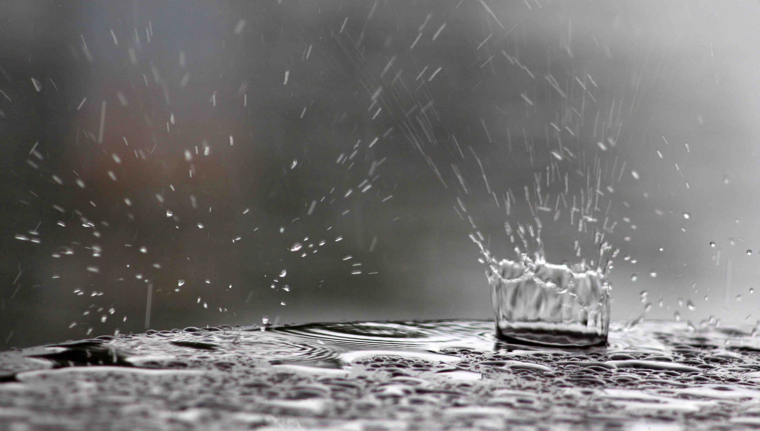 raindrops falling on a table surface