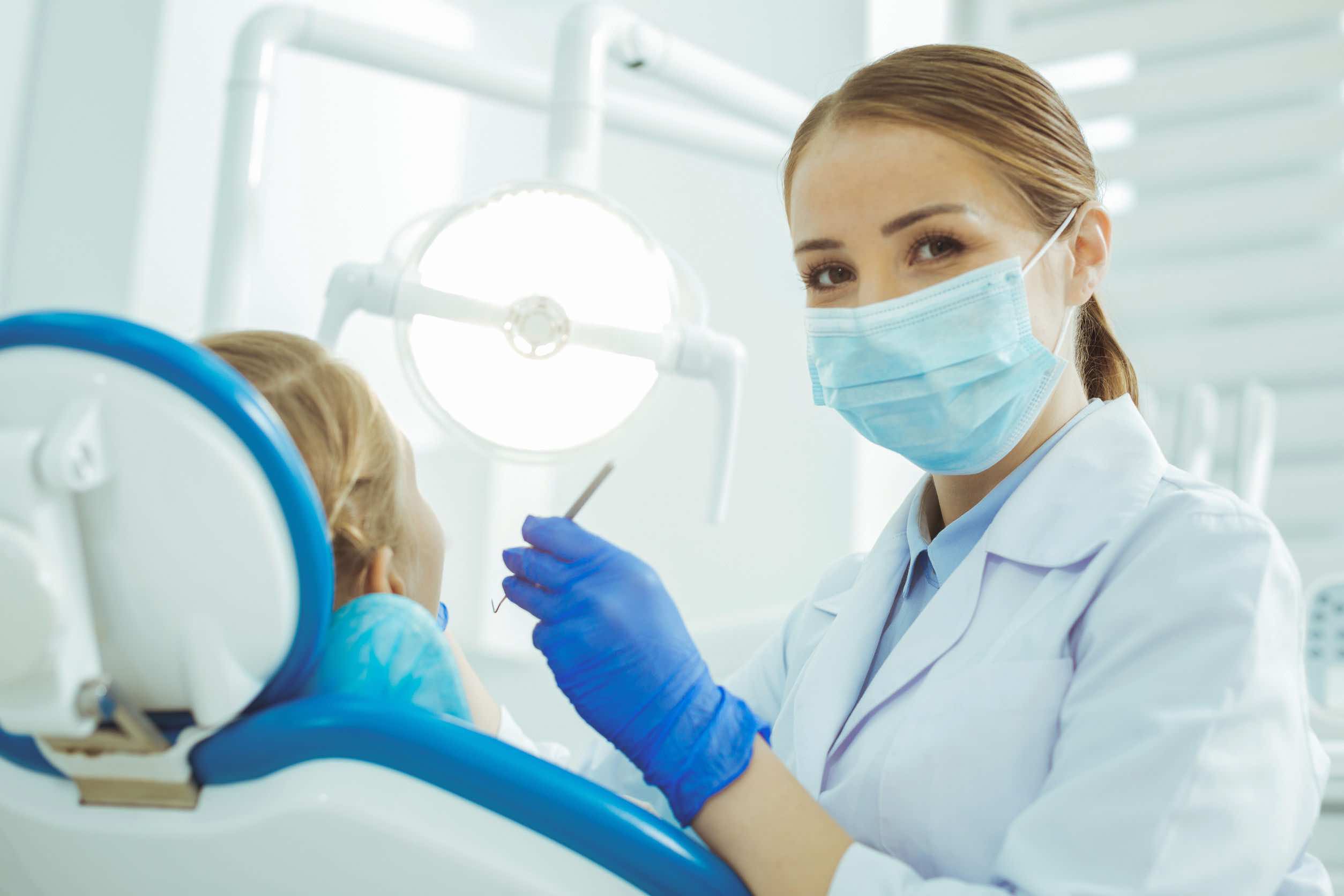 Beautiful dentist enjoying her job