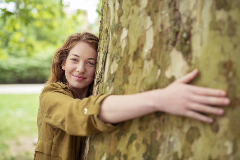 Blond Teen Girl Hugging Huge Tree Trunk