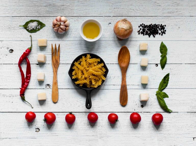 Top view of all the necessary food component to make a classic italian pasta