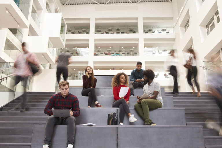 71304813 - interior of busy university campus building with students